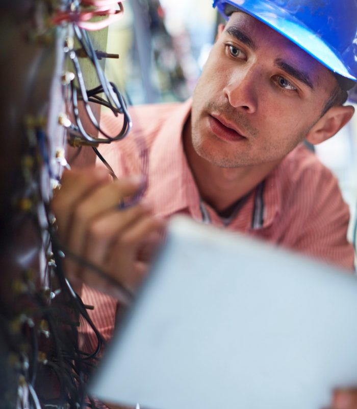 Electrician testing wires